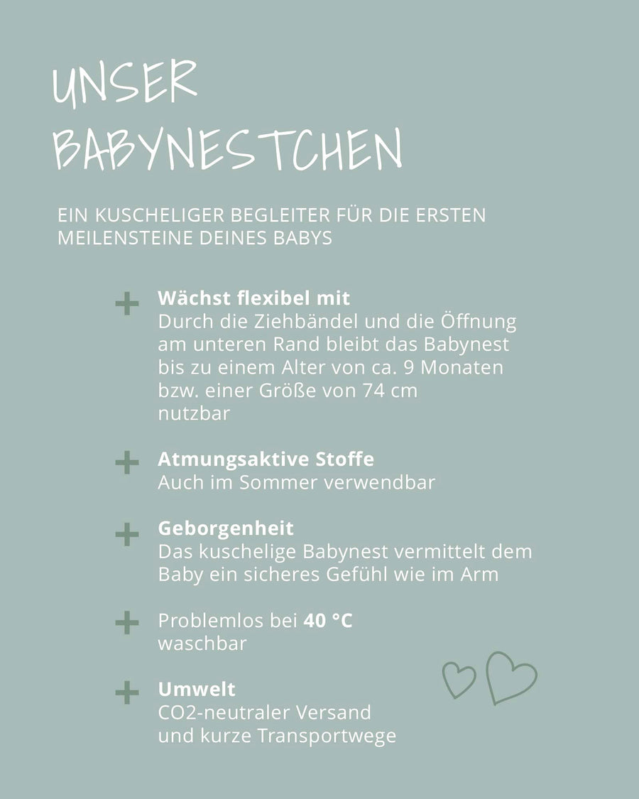 Reversible Babynest Unterwasserwelt with adjustable ties, featuring a blue ocean design with sea creatures.