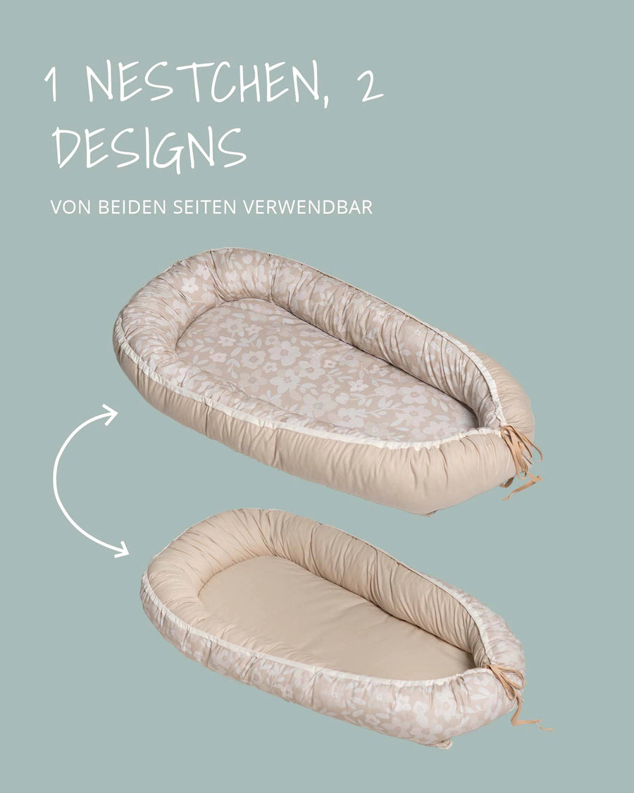 Reversible beige babynest with floral pattern on one side and solid beige on the other, for babies 0-9 months.