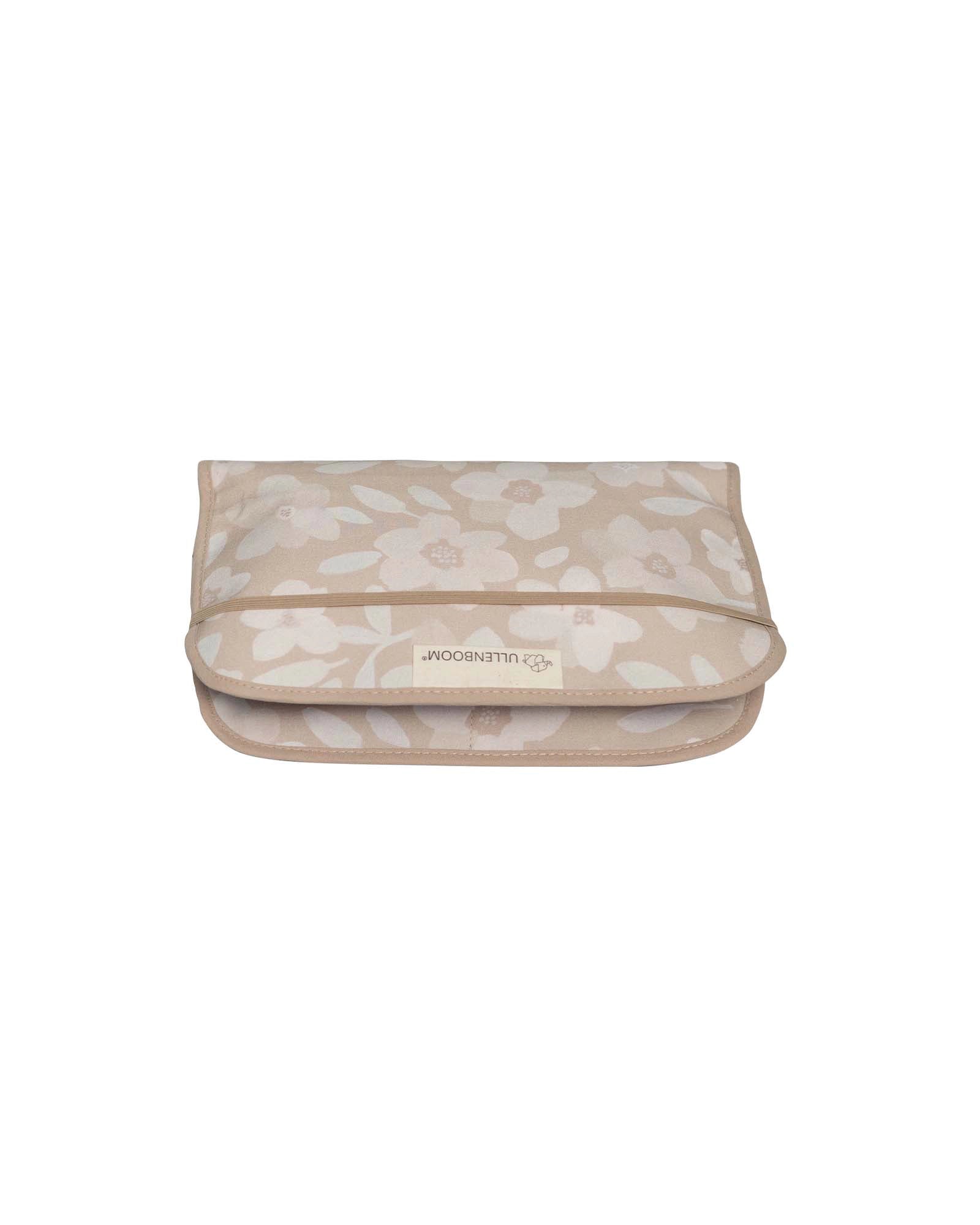 Beige cotton diaper clutch with hand-painted floral design and Ullenboom logo.