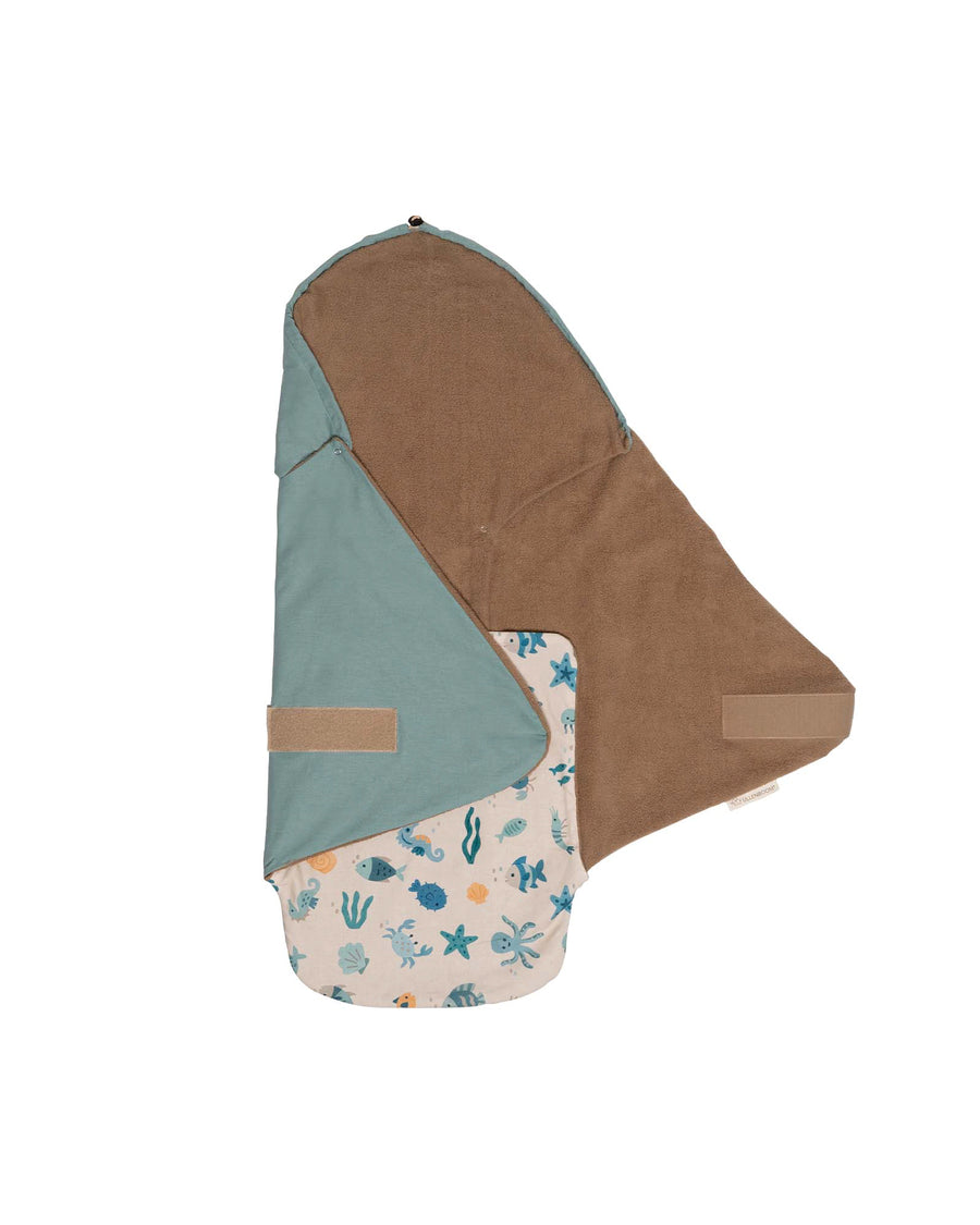 Baby wrap blanket in brown and teal with an underwater sea creature pattern.