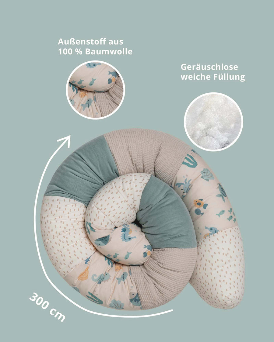 Soft 300cm baby bed snake in beige, mint, and underwater world print cotton, with silent, soft filling.