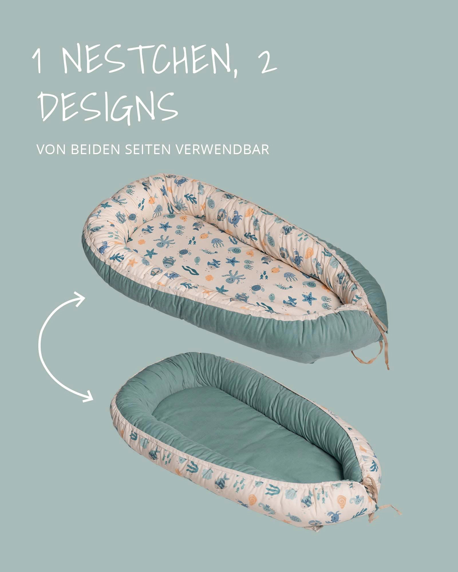 Reversible baby nest with underwater world print and solid teal side, made of soft cotton.